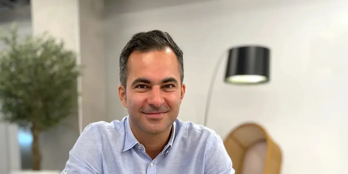 Hamed Farhadian at a meeting table