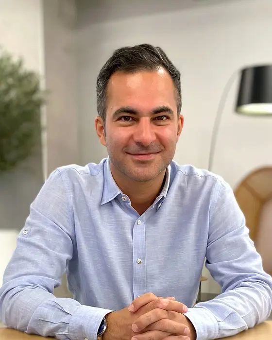 Hamed Farhadian at a meeting table